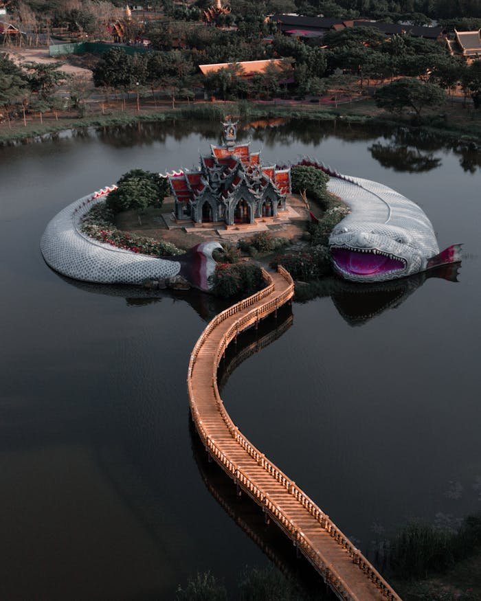 A captivating aerial view of a unique serpent structure encircling an island in Bangkok, Thailand.
